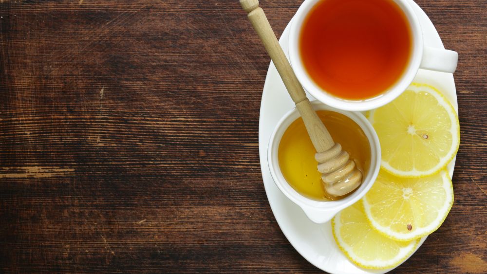 Black tea served with lemon and honey